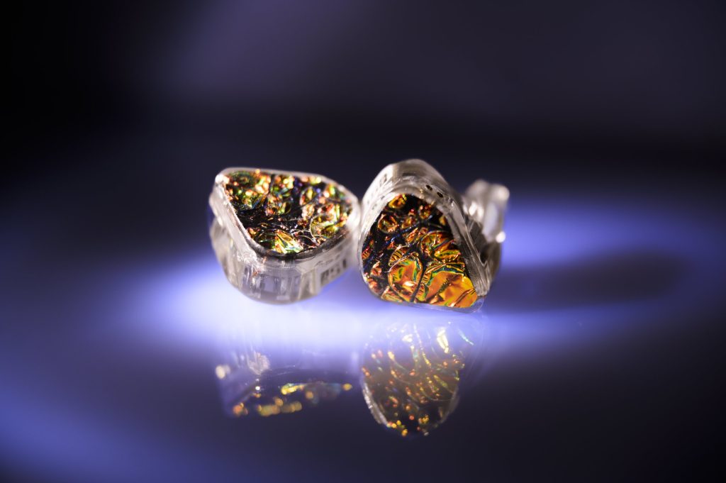 Hexad II dichroic fire faceplates glowing under studio light